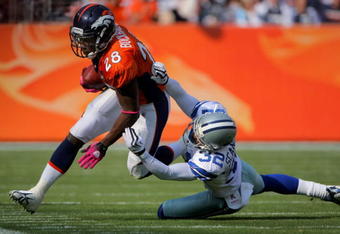 DENVER - OCTOBER 04:  Correll Buckhalter #28 of the Denver Broncos makes a reception and is tackled by Orlando Scandrick #32 of the Dallas Cowboys during NFL action at Invesco Field at Mile High on October 4, 2009 in Denver, Colorado.  (Photo by Doug Pensinger/Getty Images)