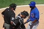CHICAGO - JUNE 28:  Milton Brandley #21 of the Chicago Cubs asks for the count from home plate umpire Brain Runge #71 as A.J. Pierzynski #12 of the Chicago White Sox listens on June 28, 2009 at U.S. Cellular Field in Chicago, Illinois. The White Sox defeated the Cubs 6-0. (Photo by Jonathan Daniel/Getty Images)