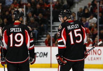 OTTAWA - MARCH 11:  Jason Spezza #19 and Dany Heatley #15 of the Ottawa Senators stand on the ice during the game against the Tampa Bay Lightning on March 11, 2009 at the Scotiabank Place in Ottawa, Ontario, Canada. (Photo by Phillip MacCallum/Getty Images)