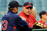 ANAHEIM, CA - APRIL 10:  Mike Scioscia #14 manager of the Los Angeles Angels is comforted by Jason Varitek #33 catcher of the Boston Red Sox at Angel Stadium before the start of their game April 10, 2009 in Anaheim, California, one day after Angels rookie pitcher Nick Adenhart's death. Adenhart and two others were killed in car crash on April 9.  (Photo by Kevork Djansezian/Getty Images)