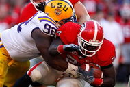 ATHENS, GA - OCTOBER 03: Drake Nevis #92 of the Louisiana State University Tigers tackles Washaun Ealey #24 of the Georgia Bulldogs at Sanford Stadium on October 3, 2009 in Athens, Georgia. (Photo by Kevin C. Cox/Getty Images)