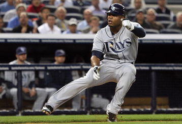 NEW YORK - SEPTEMBER 08:  Carl Crawford #13 of the Tampa Bay Rays is caught in a first inning rundown against the New York Yankees on September 8, 2009 at Yankee Stadium in the Bronx borough of New York City.  (Photo by Jim McIsaac/Getty Images)