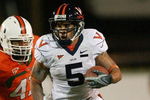 CORAL GABLES, FL - NOVEMBER 10:  Running back Mikell Simpson #5 of the Virginia Cavaliers breaks away from defensive lineman Vegas Franklin #47 of the Miami Hurricanes at the Orange Bowl November 10, 2007 in Coral Gables, Florida.  (Photo by Doug Benc/Getty Images)