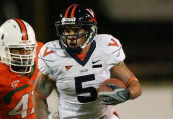 CORAL GABLES, FL - NOVEMBER 10:  Running back Mikell Simpson #5 of the Virginia Cavaliers breaks away from defensive lineman Vegas Franklin #47 of the Miami Hurricanes at the Orange Bowl November 10, 2007 in Coral Gables, Florida.  (Photo by Doug Benc/Getty Images)