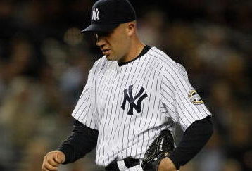NEW YORK - SEPTEMBER 30: Alfredo Aceves #91 of the New York Yankees walks back to the dugout during the game against the Kansas City Royals on September 30, 2009 at Yankee Stadium in the Bronx borough of New York City. (Photo by Jared Wickerham/Getty Images)
