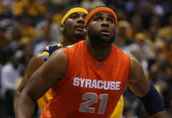 MILWAUKEE - MARCH 07: Arinze Onuaku #21 of the Syracuse Orange boxes out Lazar Hayward #32 of the Marquette Golden Eagles on March 7, 2009 at the Bradley Center in Milwaukee, Wisconsin. Syracuse defeated Marquette 86-79 in overtime. (Photo by Jonathan Daniel/Getty Images)