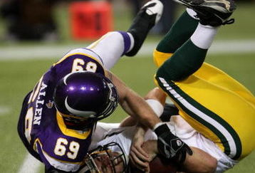 MINNEAPOLIS - NOVEMBER 09:  Defensive end Jared Allen #69 of the Minnesota Vikings sacks quarterback Aaron Rodgers #12 of the Green Bay Packers on November 9, 2008 at the Metrodome in Mineapolis, Minnesota.  (Photo by Stephen Dunn/Getty Images)