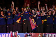 BARCELONA, SPAIN - MAY 28: Barcelona players celebrate beside their three thophys, Copa del Rey (L), UEFA Champions League and La Liga at the Nou Camp Stadium the day after Barcelona won the UEFA Champions League Cup final on May 28, 2009 in Barcelona, Spain. Barcelona beat Manchester United in the final in Rome.  (Photo by Denis Doyle/Getty Images)