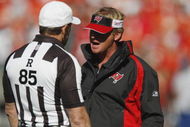 KANSAS CITY, MO - NOVEMBER 02:  Head Coach Jon Gruden of the Tampa Bay Buccaneers talks with referee Ed Hochuli #85 during the NFL game against the Kansas City Chiefs on November 2, 2008 at Arrowhead Stadium in Kansas City, Missouri.  The Buccaneers won 30 to 27 in overtime. (Photo by: Jamie Squire/Getty Images)