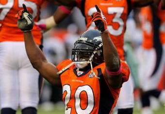DENVER - OCTOBER 04:  Brian Dawkins #20 and Renaldo Hill #23 of the Denver Broncos celebrate after the Dallas Cowboys on fourth down with :01 second remaining in the game during NFL action at Invesco Field at Mile High on October 4, 2009 in Denver, Colorado. The Broncos defeated the Cowboys 17-10.  (Photo by Doug Pensinger/Getty Images)
