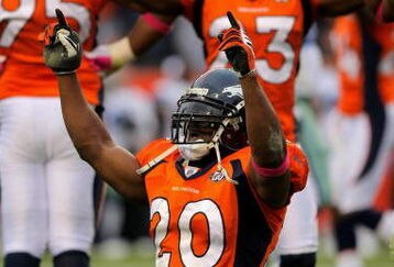 DENVER - OCTOBER 04:  Brian Dawkins #20 and Renaldo Hill #23 of the Denver Broncos celebrate after the Dallas Cowboys on fourth down with :01 second remaining in the game during NFL action at Invesco Field at Mile High on October 4, 2009 in Denver, Colorado. The Broncos defeated the Cowboys 17-10.  (Photo by Doug Pensinger/Getty Images)