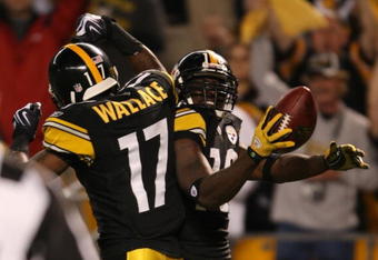 PITTSBURGH - SEPTEMBER 10:  Wide receiver Santonio Holmes #10 of the Pittsburgh Steelers celebrates his touchdown in the second quarter with teammate Mike Wallace #17 during the NFL season opener against the Tennessee Titans at Heinz Field on September 10, 2009 in Pittsburgh, Pennsylvania. (Photo by Elsa/Getty Images)