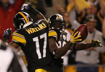 PITTSBURGH - SEPTEMBER 10:  Wide receiver Santonio Holmes #10 of the Pittsburgh Steelers celebrates his touchdown in the second quarter with teammate Mike Wallace #17 during the NFL season opener against the Tennessee Titans at Heinz Field on September 10, 2009 in Pittsburgh, Pennsylvania. (Photo by Elsa/Getty Images)