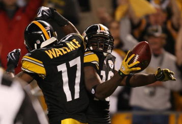 PITTSBURGH - SEPTEMBER 10:  Wide receiver Santonio Holmes #10 of the Pittsburgh Steelers celebrates his touchdown in the second quarter with teammate Mike Wallace #17 during the NFL season opener against the Tennessee Titans at Heinz Field on September 10, 2009 in Pittsburgh, Pennsylvania. (Photo by Elsa/Getty Images)