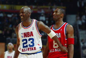 ATLANTA, GA - FEBRUARY 9:  Michael Jordan (Washington Wizards) #23 of the Eastern Conference All-Stars jokes with Kobe Bryant (Los Angeles Lakers) #8 of the Western Conference All-Stars during the 2003 NBA All-Star Game on February 9, 2003 at Philips Arena in Atlanta, Georgia.  NOTE TO USER:  User expressly acknowledges and agrees that, by downloading and or using this photograph, user is consenting to the terms and conditions of the Getty Images license agreement. (Photo by Jamie Squire/Getty Images)
