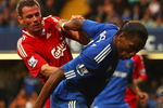 LONDON - OCTOBER 04:  Jamie Carragher of Liverpool (L) tussles with Didier Drogba of Chelsea during the Barclays Premier League match between Chelsea and Liverpool at Stamford Bridge on October 4, 2009 in London, England.  (Photo by Ian Walton/Getty Images)
