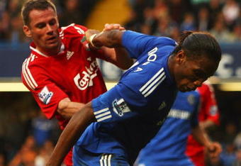 LONDON - OCTOBER 04:  Jamie Carragher of Liverpool (L) tussles with Didier Drogba of Chelsea during the Barclays Premier League match between Chelsea and Liverpool at Stamford Bridge on October 4, 2009 in London, England.  (Photo by Ian Walton/Getty Images)
