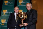 NORTH PALM BEACH, FL - FEBRUARY 26:  PGA Tour Commissioner Tim Finchem and Greg Norman pose with the President's Cup trophy after Finchem announced that Norman and Fred Couples will be the captains for the 2009 President's Cup at PGA National on February 26, 2008 in North Palm Beach, Florida. The biennial team competition is to be held at San Francisco's Harding Park Golf Course.  (Photo by Doug Benc/Getty Images)