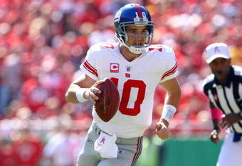 KANSAS CITY, MO - OCTOBER 04:  Quarterback Eli Manning #10 of the New York Giants scrambles during the game against the Kansas City Chiefs on October 4, 2009 at Arrowhead Stadium in Kansas City, Missouri.  (Photo by Jamie Squire/Getty Images)
