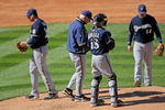 DENVER - OCTOBER 01:  Starting pitcher Manny Parra #26 of the Milwaukee Brewers is removed from the game by manager Ken Macha #40 in the third inning against the Colorado Rockies at Coors Field on October 1, 2009 in Denver, Colorado.  (Photo by Doug Pensinger/Getty Images)