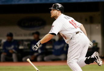MINNEAPOLIS, MN - OCTOBER 4: Jason Kubel #16 of the Minnesota Twins watches as the ball heads to the stands, hitting a three-run home run against the Kansas City Royals in the third inning at Hubert H. Humphrey Metrodome on October 4, 2009 in Minneapolis, Minnesota. (Photo by Genevieve Ross/Getty Images)