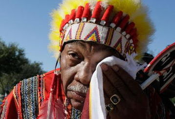 MIAMI - DECEMBER 03:  Washington Redskins 'unofficial' mascot Zema Williams known as Chief Zee wipes his face as he arrives for the funeral of Redskins football player, Sean Taylor, at the Pharmed Arena at Florida International University December 3, 2007 in Miami, Florida. Taylor died November 27, one day after being shot at his home in Miami.  (Photo by Joe Raedle/Getty Images)