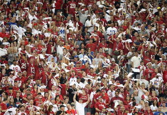 GLENDALE, AZ - SEPTEMBER 27:  Fans for the Arizona Cardinals cheer during the NFL game against the Indianapolis Colts at the Universtity of Phoenix Stadium on September 27, 2009 in Glendale, Arizona.  The Colts defeated the Cardinals 31-10.  (Photo by Christian Petersen/Getty Images)