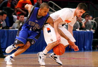 NEW YORK - MARCH 11: Jordan Theodore #10 of the Seton Hall Pirates goes for a steal from Jake Presutti #5 of the Syracuse Orange during the second round of the Big East Tournament at Madison Square Garden on March 11, 2009 in New York City.  (Photo by Jim McIsaac/Getty Images)