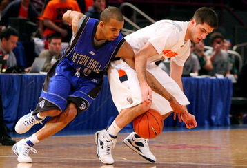 NEW YORK - MARCH 11: Jordan Theodore #10 of the Seton Hall Pirates goes for a steal from Jake Presutti #5 of the Syracuse Orange during the second round of the Big East Tournament at Madison Square Garden on March 11, 2009 in New York City.  (Photo by Jim McIsaac/Getty Images)