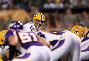 MINNEAPOLIS - NOVEMBER 09:  Quarterback Aaron Rodgers #12 of the Green Bay Packers calls signals against the Minnesota Vikings on November 9, 2008 at the Metrodome in Mineapolis, Minnesota.  The Vikings won 28-27.  (Photo by Stephen Dunn/Getty Images)