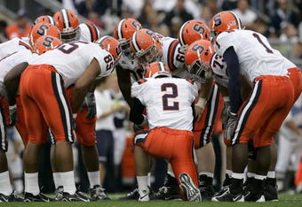 STATE COLLEGE, PA - SEPTEMBER 12: Quarterback Greg Paulus #2 of the Syracuse Orangemen talks to his team in the huddle during the first half against the Penn State Nittany Lions at Beaver Stadium  September 12, 2009 in State College, Pennsylvania. (Photo by Chris Gardner/Getty Images)