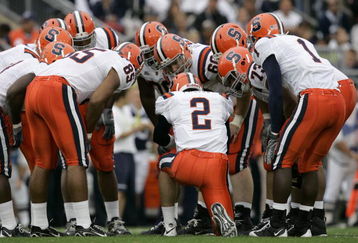 STATE COLLEGE, PA - SEPTEMBER 12: Quarterback Greg Paulus #2 of the Syracuse Orangemen talks to his team in the huddle during the first half against the Penn State Nittany Lions at Beaver Stadium  September 12, 2009 in State College, Pennsylvania. (Photo by Chris Gardner/Getty Images)
