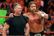 LAS VEGAS - AUGUST 24:  World Wrestling Entertainment Inc. Chairman Vince McMahon (L) and wrestler Triple H appear in the ring during the WWE Monday Night Raw show at the Thomas & Mack Center August 24, 2009 in Las Vegas, Nevada.  (Photo by Ethan Miller/Getty Images)
