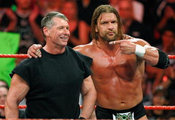 LAS VEGAS - AUGUST 24:  World Wrestling Entertainment Inc. Chairman Vince McMahon (L) and wrestler Triple H appear in the ring during the WWE Monday Night Raw show at the Thomas & Mack Center August 24, 2009 in Las Vegas, Nevada.  (Photo by Ethan Miller/Getty Images)