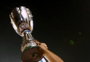 BEIJING - AUGUST 08:  Tommaso Rocchi captain of Lazio celebrates victory with the cup after the Beijing 2009 Supercup match between Inter Milan and Lazio at the Birds Nest on August 8, 2009 in Beijing, China.  (Photo by Feng Li/Getty Images)
