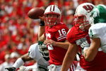 MADISON, WI - SEPTEMBER 26:  Scott Tolzien #16 of the Wisconsin Badgers passes under pressure from the Michigan State Spartans on September 26, 2009 at Camp Randall Stadium in Madison, Wisconsin.  (Photo by Jonathan Daniel/Getty Images)