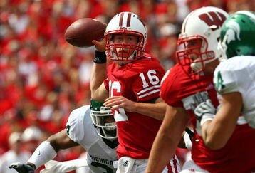 MADISON, WI - SEPTEMBER 26:  Scott Tolzien #16 of the Wisconsin Badgers passes under pressure from the Michigan State Spartans on September 26, 2009 at Camp Randall Stadium in Madison, Wisconsin.  (Photo by Jonathan Daniel/Getty Images)