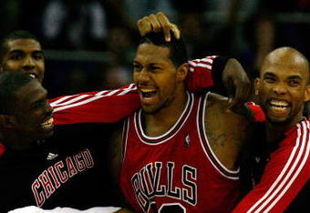 LONDON, ENGLAND - OCTOBER 06:  James Johnson (C) of the Chicago Bulls celebrates with team mates after scoring the winning shot in the final second during the NBA pre-season game as part of the 2009 NBA Europe Live Tour between Chicago Bulls and Utah Jazz at the O2 Arena on October 6, 2009 in London, England.  NOTE TO USER: User expressly acknowledges and agrees that, by downloading and/or using this Photograph, user is consenting to the terms and conditions of the Getty Images License Agreement.  (Photo by Clive Rose/Getty Images)