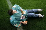 MIAMI - JANUARY 27:  Carlos Rios, 4-years-old, from Miami tries on a set of shoulder pads during the NFL Experience at Miami Dolphin Stadium on January 27, 2007 in Miami, Florida.  (Photo by Eliot J. Schechter/Getty Images)