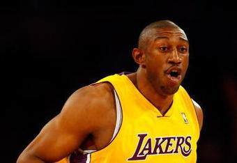 LOS ANGELES, CA - APRIL 03:  DJ Mbenga #28 of the Los Angeles Lakers gestures against the Houston Rockets during the game at Staples Center on April 3, 2009 in Los Angeles, California.  The Lakers defeated the Rockets 93-81. NOTE TO USER: User expressly acknowledges and agrees that, by downloading and/or using this Photograph, user is consenting to the terms and conditions of the Getty Images License Agreement.  (Photo by Jeff Gross/Getty Images)