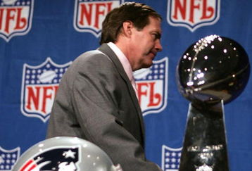 JACKSONVILLE, FL - FEBRUARY 4:  Bill Belichick, head coach of the New England Patriots, walks past the Vince Lombardi trophy after refusing to pose with it at a pre Superbowl press conference February 4, 2005 at the Prime F. Osborn Convention Center in Jacksonville, Florida.  (Photo by Al Bello/Getty Images)