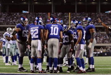 ARLINGTON, TX - SEPTEMBER 20:  The New York Giants huddle up during play against the Dallas Cowboys at Cowboys Stadium on September 20, 2009 in Arlington, Texas.  (Photo by Ronald Martinez/Getty Images)