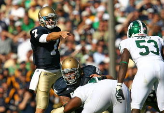 SOUTH BEND, IN - SEPTEMBER 19: Jimmy Clausen #7 of the Notre Dame Fighting Irish points out a defensive alingment including Greg Jones #53 of the Michigan State Spartans on September 19, 2009 at Notre Dame Stadium in South Bend, Indiana. Notre Dame defeated Michigan State 33-30. (Photo by Jonathan Daniel/Getty Images)