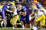 GAINESVILLE, FL - OCTOBER 11: Quarterback Tim Tebow #15 of the Florida Gators rushes upfield against the LSU Tigers at Ben Hill Griffin Stadium on October 11, 2008 in Gainesville, Florida.  (Photo by Al Messerschmidt/Getty Images) 