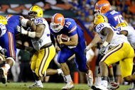 GAINESVILLE, FL - OCTOBER 11: Quarterback Tim Tebow #15 of the Florida Gators rushes upfield against the LSU Tigers at Ben Hill Griffin Stadium on October 11, 2008 in Gainesville, Florida.  (Photo by Al Messerschmidt/Getty Images) 