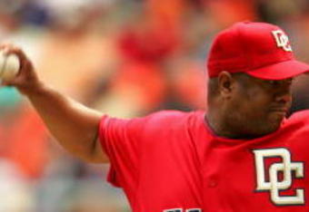 WASHINGTON ? APRIL 13:  Pitcher Livan Hernandez #61 of the Washington Nationals delivers a pitch against the New York Mets on April 13, 2006 at RFK Stadium in Washington, DC.  The Mets won 13-4.  (Photo by Jamie Squire/Getty Images) 