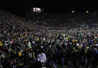 IOWA CITY, IOWA - NOVEMBER 8: Iowa Hawkeyes fans rush the field and celebrate as their team upset the Penn State Nittany Lions by kicking a field goal with six seconds left on the clock at Kinnick Stadium on November 8, 2008 in Iowa City, Iowa. Iowa defeated Penn State  24-23. (Photo by David Purdy/Getty Images)