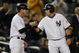 NEW YORK - SEPTEMBER 30: Francisco Cervelli #29 is congratulated by third base coach Rob Thomson #59 of the New York Yankees in the 9th inning during the game against the Kansas City Royals on September 30, 2009 at Yankee Stadium in the Bronx borough of New York City. (Photo by Jared Wickerham/Getty Images)