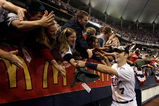 MINNEAPOLIS - OCTOBER 06:  Joe Mauer #7 of the Minnesota Twins circles the field celebrating with fans after the Twins defeated  the Detroit Tigers to win the American League Tiebreaker game on October 6, 2009 at Hubert H. Humphrey Metrodome in Minneapolis, Minnesota.  (Photo by Jamie Squire/Getty Images)