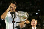 MELBOURNE, AUSTRALIA - JANUARY 29: Roger Federer of Switzerland cries as he collects the trophy after victory in his Men's Singles Final match against Marcos Baghdatis of Cyprus during day fourteen of the Australian Open at Melbourne Park January 29, 2006 in Melbourne, Australia.  (Photo by Phil Walter/Getty Images) 